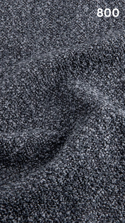 Close-up of textured blue bouclé fabric for sofas with a pattern and number '800' in the corner.
