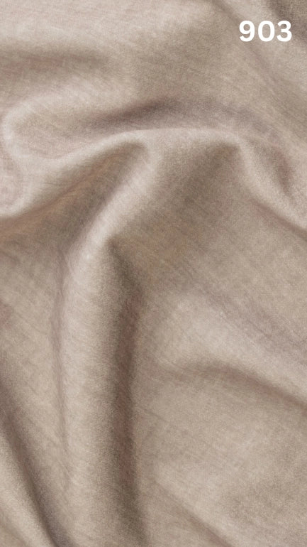 Close-up of beige colored velvet fabric for sofas with a slight pattern and number '903' in the corner.