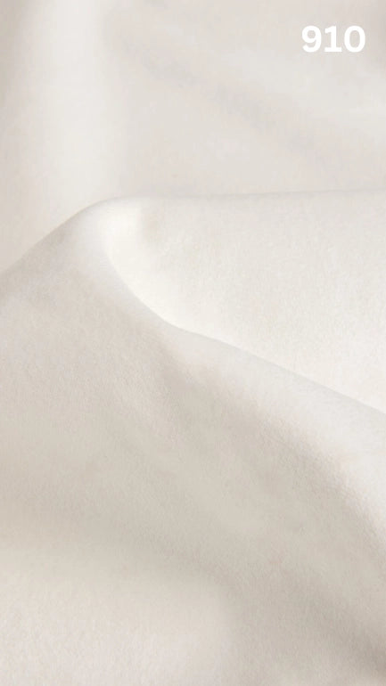 Premium velvet fabric for sofas in white with a number '910' in the corner.