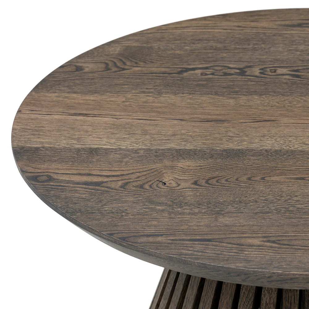 Capella Solid Wood Round Coffee Table in Dark Charcoal Oak with a sleek wood grain finish and a sturdy pipe-cone shaped leg for a modern, stylish look.