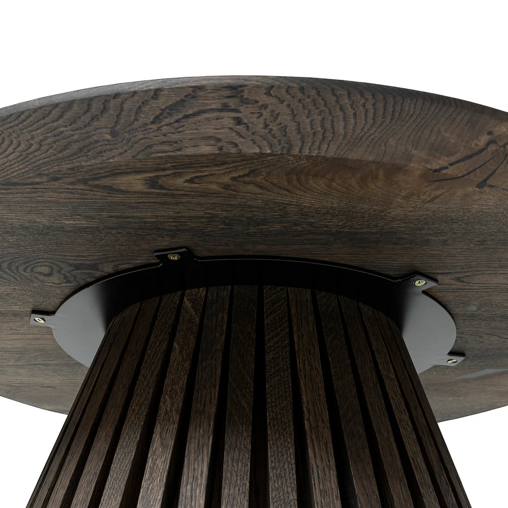 Capella Solid Wood Round Coffee Table in Dark Charcoal Oak with a sleek wood grain finish and a sturdy pipe-cone shaped leg for a modern, stylish look.