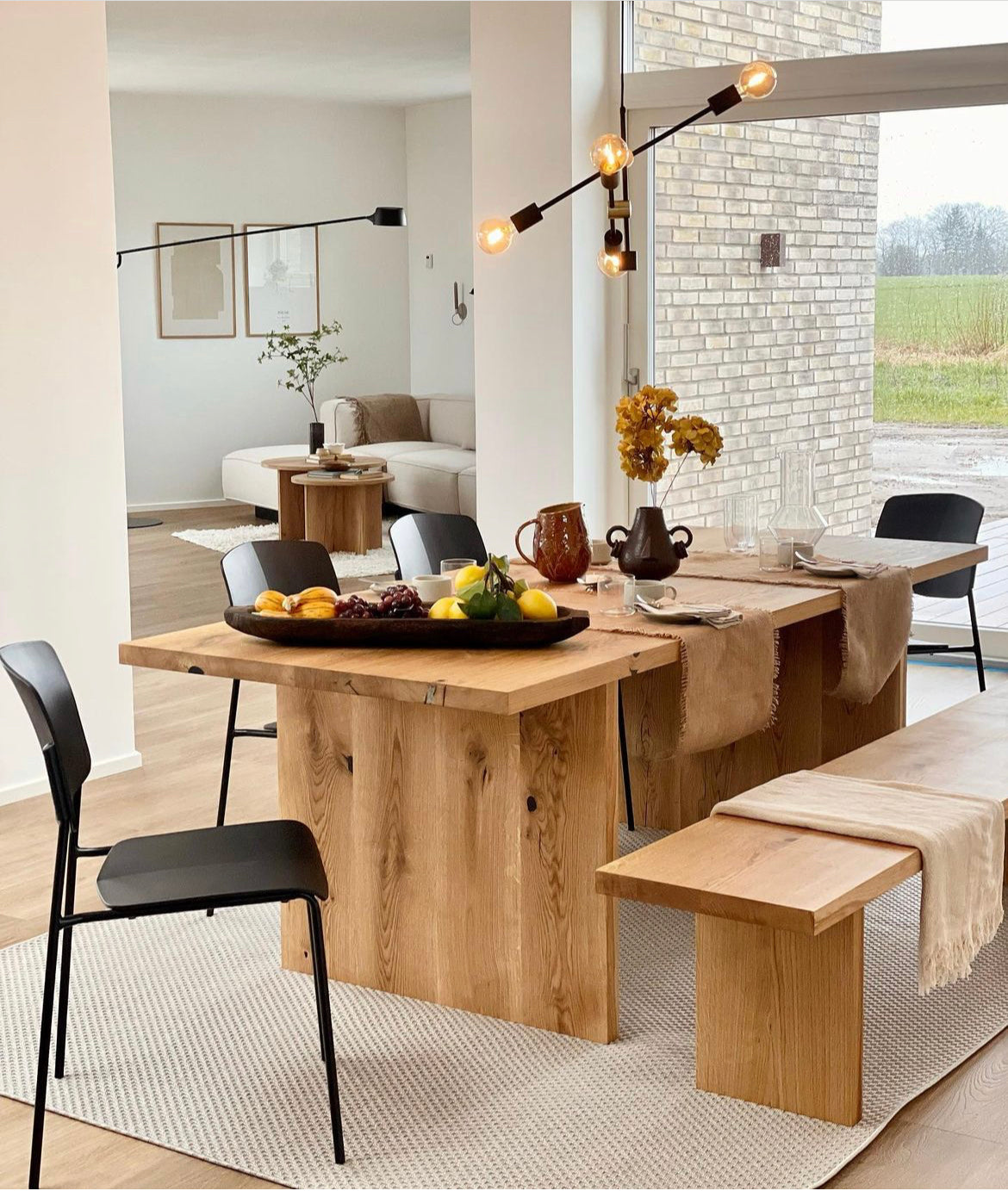 Luxury oak dining table with wood plate legs – perfect for modern interiors with a vibe of rustic style.