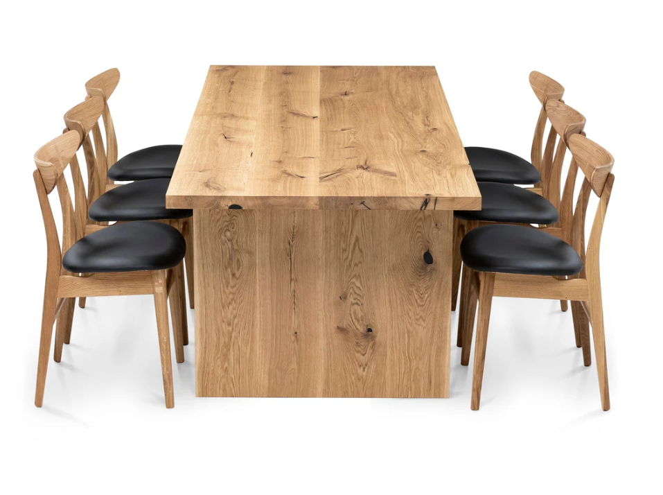 Luxury oak dining table with wood plate legs – perfect for modern interiors with a vibe of rustic style.