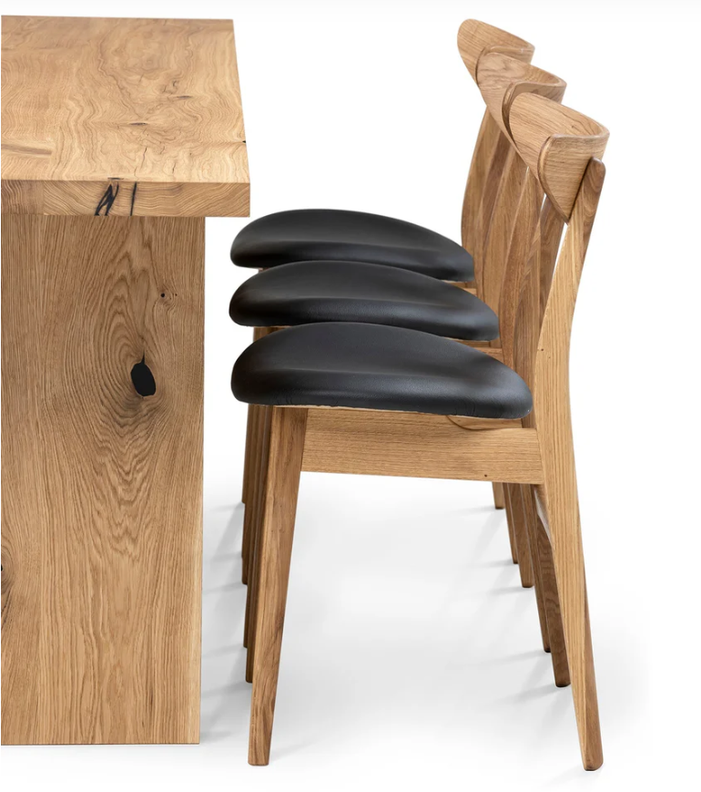 Luxury oak dining table with wood plate legs – perfect for modern interiors with a vibe of rustic style.