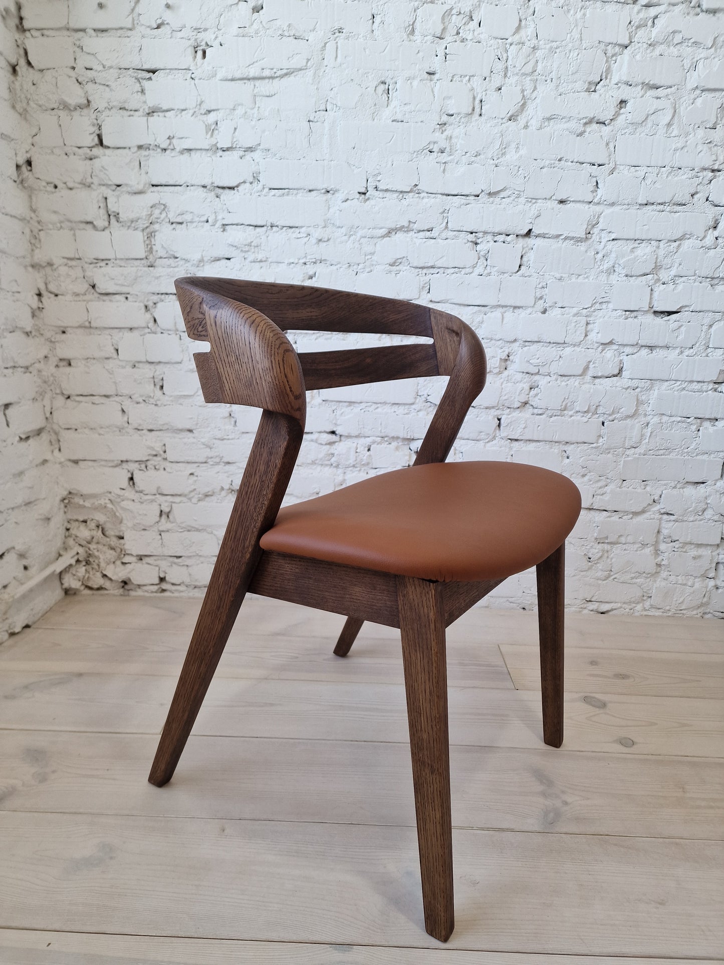 Solid walnut and natural leather curved dining chairs - style and high quality.