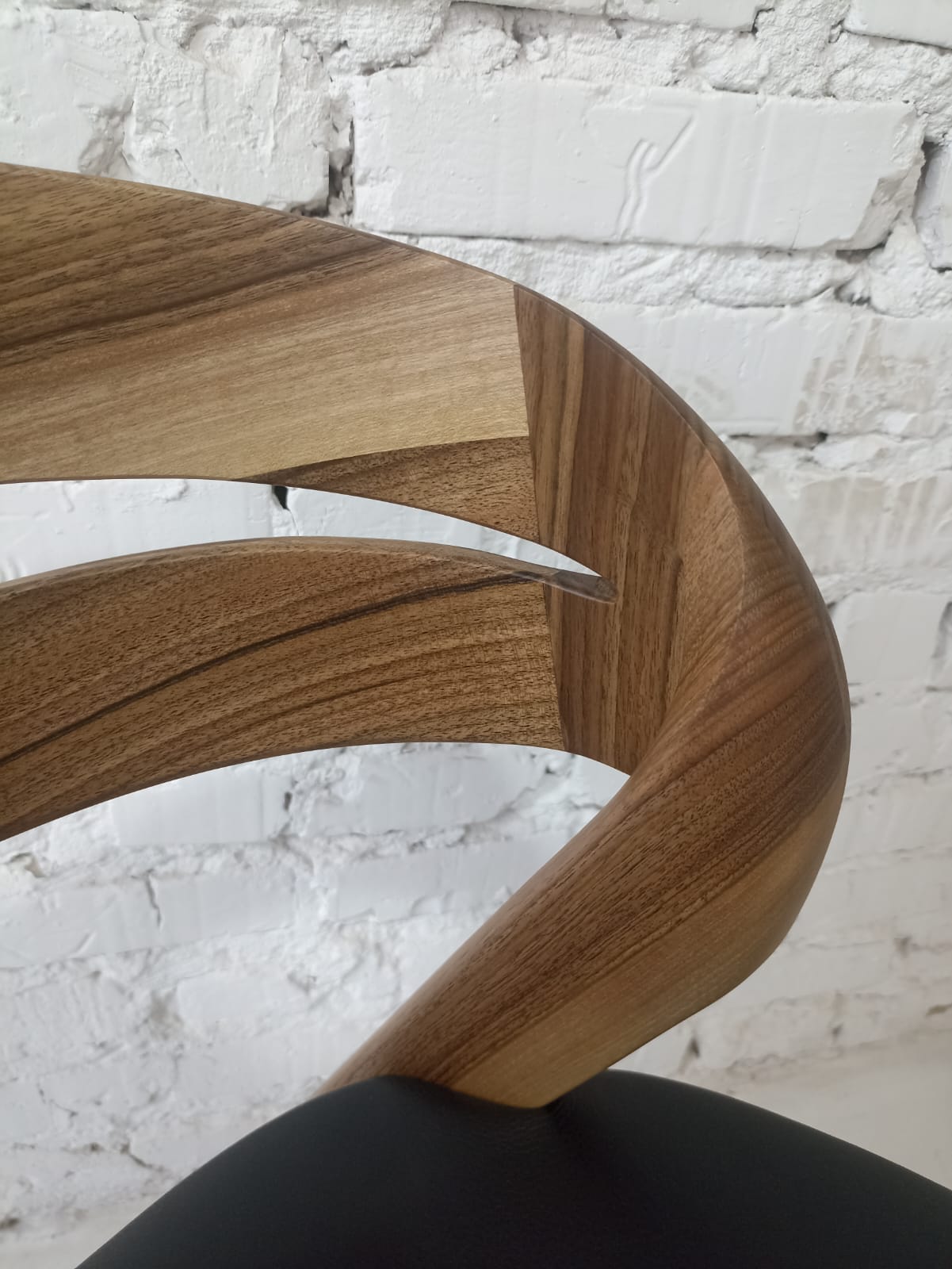 Solid walnut and natural leather curved dining chairs - style and high quality.