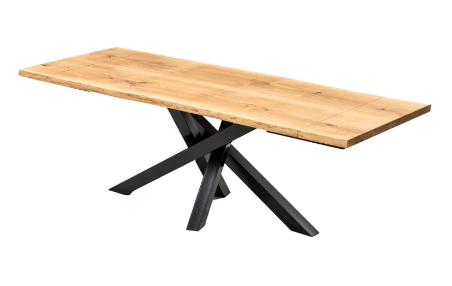 Handcrafted oak dining table with a sturdy black metal spider leg design.