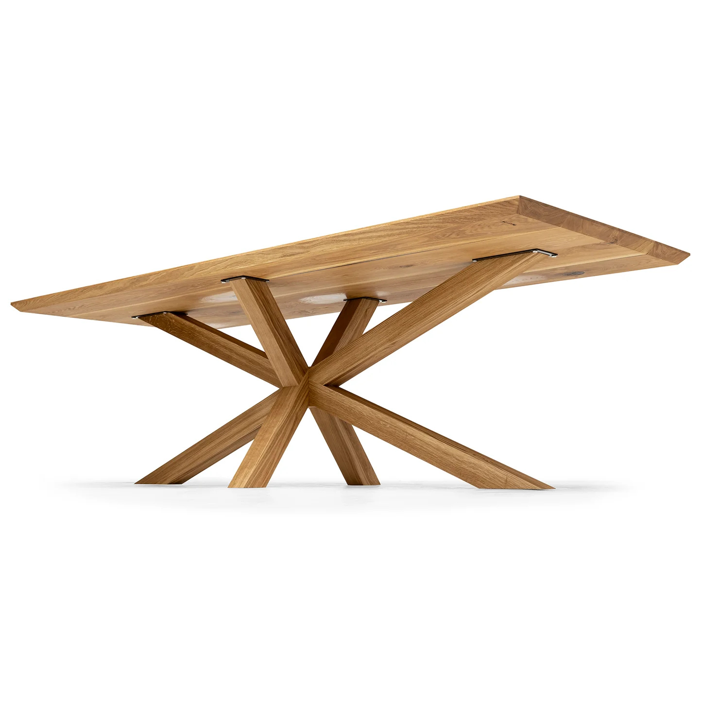 Elegant wooden dining table in natural oak with a bold spider leg frame.