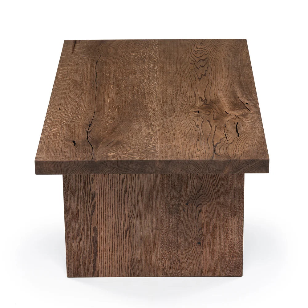 Megan solid wood coffee table in chocolate oak finish, showcasing timeless design and handcrafted from FSC-certified oak for durability and style. Its rich wood grain, sleek lines, and robust construction make it a versatile, sustainable centerpiece for modern and classic interiors.