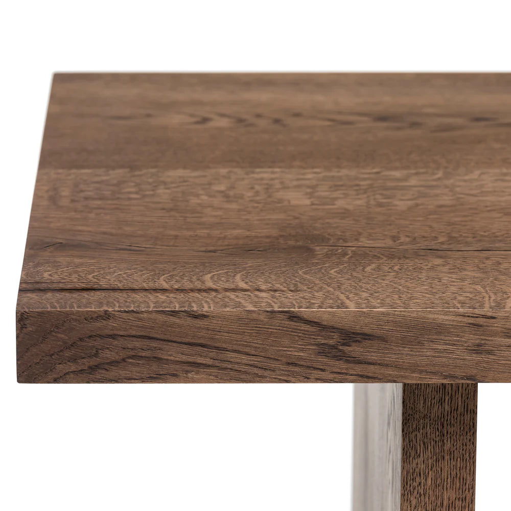 Megan solid wood coffee table in chocolate oak finish, showcasing timeless design and handcrafted from FSC-certified oak for durability and style. Its rich wood grain, sleek lines, and robust construction make it a versatile, sustainable centerpiece for modern and classic interiors.