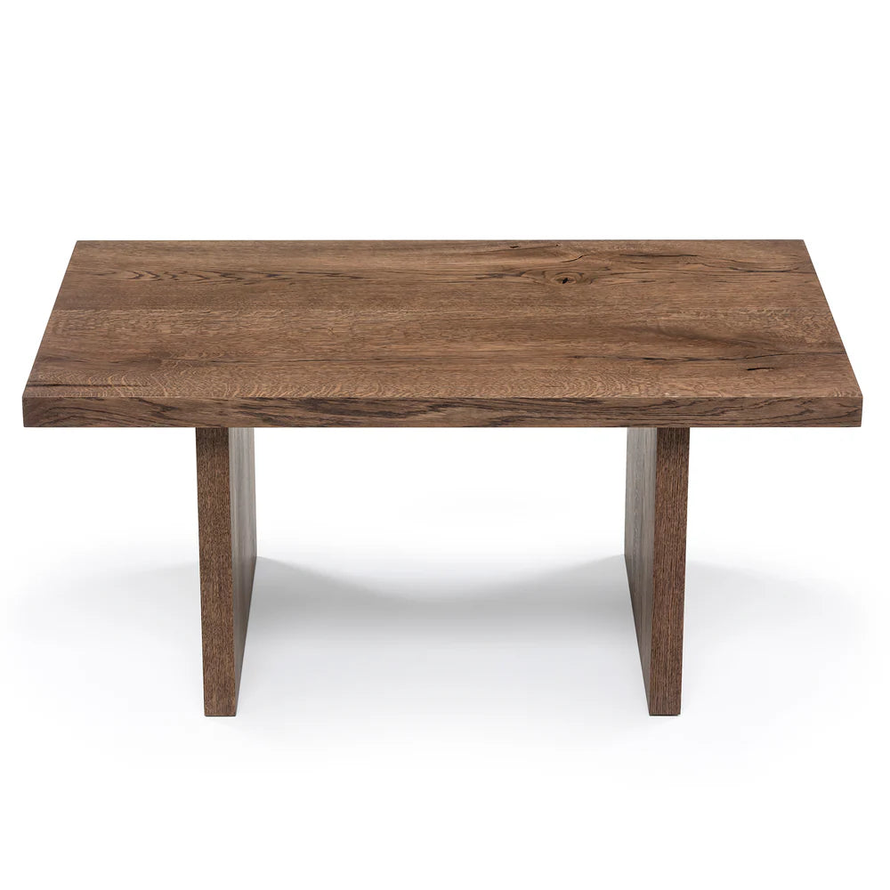 Megan solid wood coffee table in chocolate oak finish, showcasing timeless design and handcrafted from FSC-certified oak for durability and style. Its rich wood grain, sleek lines, and robust construction make it a versatile, sustainable centerpiece for modern and classic interiors.