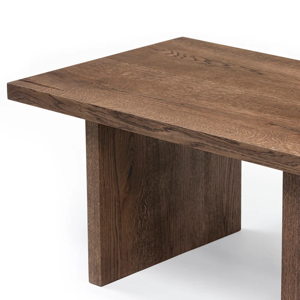 Megan solid wood coffee table in chocolate oak finish, showcasing timeless design and handcrafted from FSC-certified oak for durability and style. Its rich wood grain, sleek lines, and robust construction make it a versatile, sustainable centerpiece for modern and classic interiors.