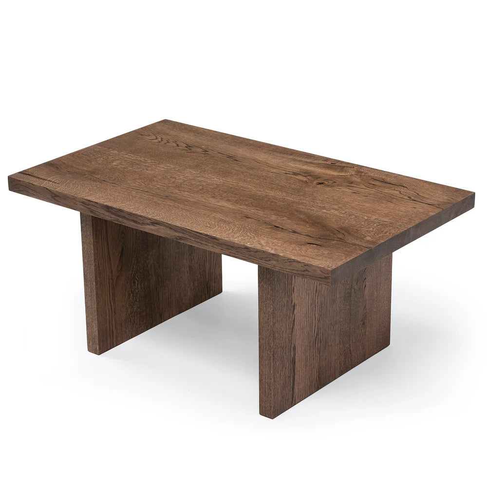 Megan solid wood coffee table in chocolate oak finish, showcasing timeless design and handcrafted from FSC-certified oak for durability and style. Its rich wood grain, sleek lines, and robust construction make it a versatile, sustainable centerpiece for modern and classic interiors.