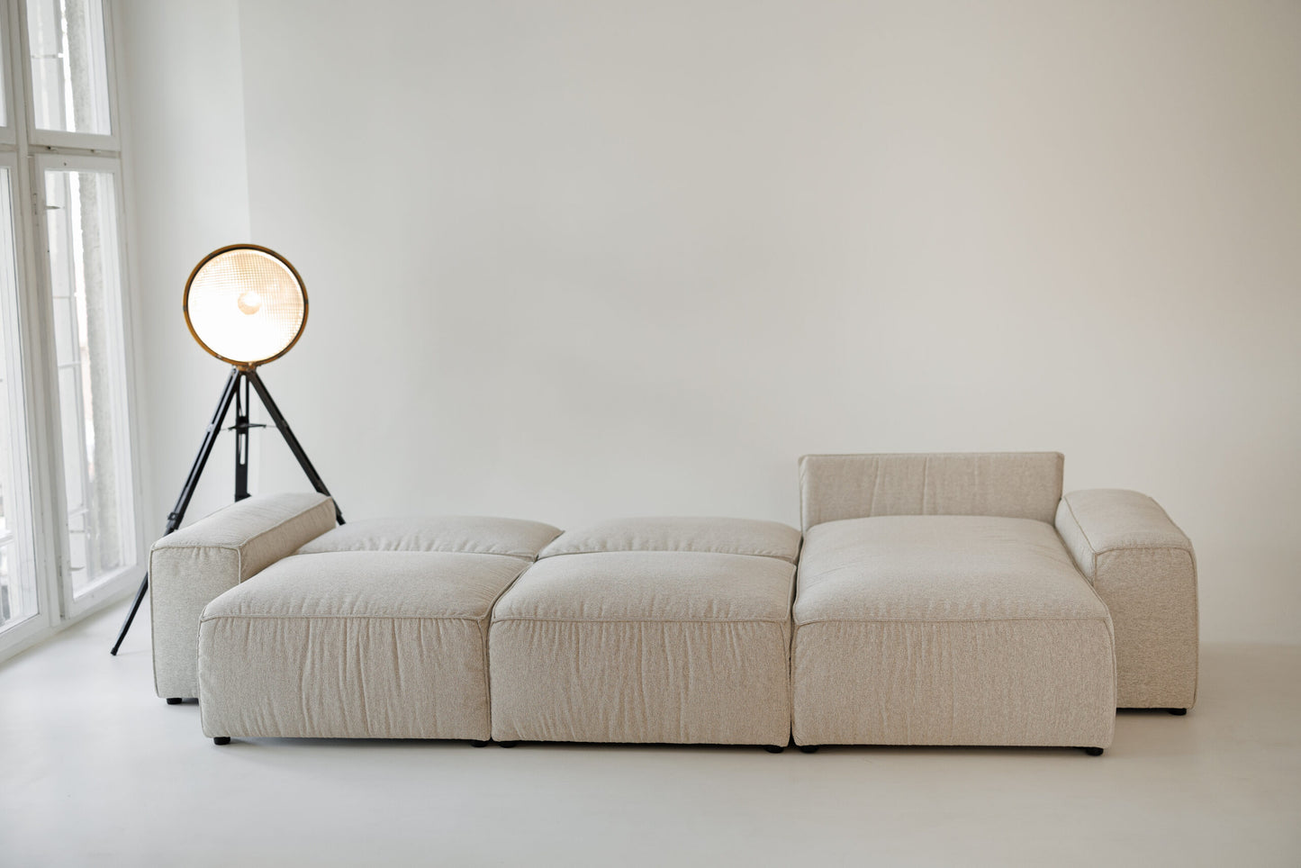 Milano modular sofa in premium Belgian fabric, corner view – extendable bespoke sofa with built-in storage, low-profile modern design, upholstered in premium durable fabric, featuring polyurethane and memory foam seat cushions with plywood frame. Stylish and functional seating and sleeping solution for contemporary interiors.