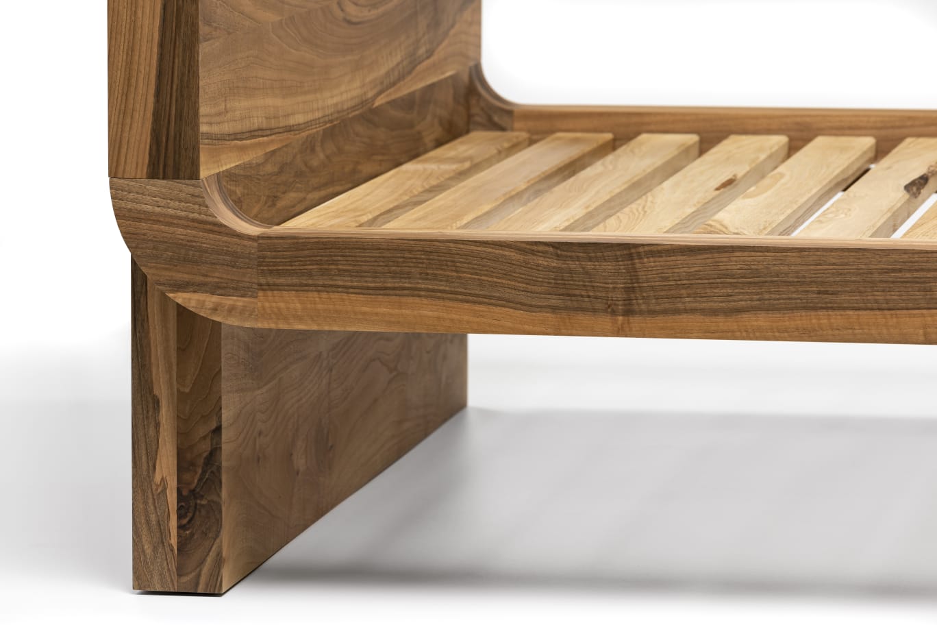Naby handmade solid wood bed crafted from FSC certified clear walnut planks, featuring a bespoke, custom design that highlights natural wood grain. This premium, sustainable bed frame blends luxury craftsmanship with minimalist style — a timeless piece for modern bedrooms focused on quality and comfort.