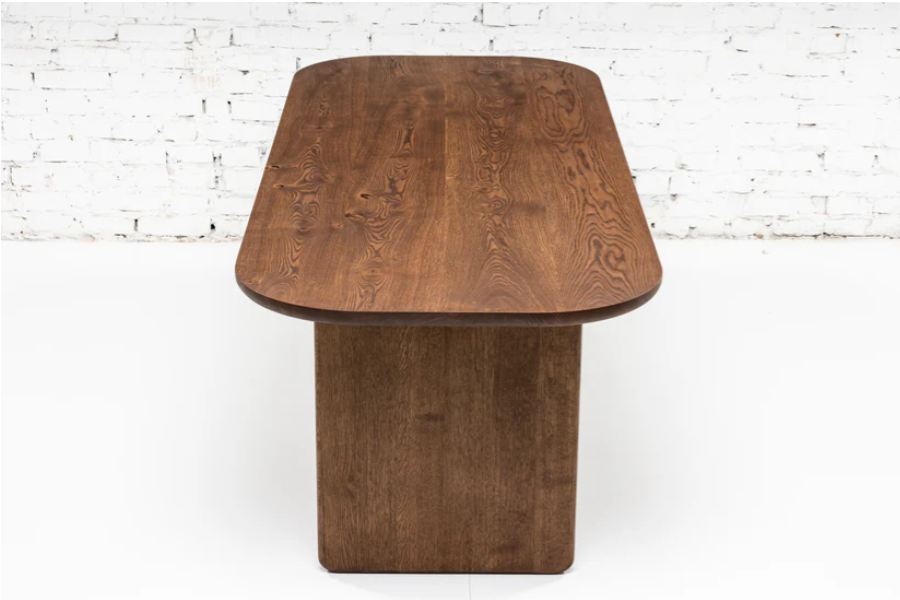 Handcrafted solid wood dining table with wooden plate legs in chocolate oak.