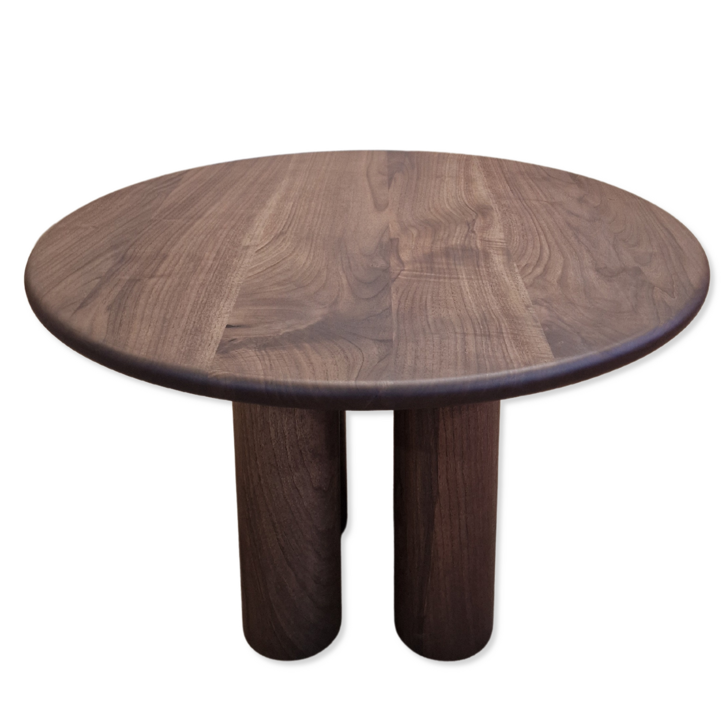 Ameline bespoke round dining table crafted from FSC certified solid walnut wood planks, featuring a minimalist designer style. This premium, sustainable piece by Talia Haus blends custom craftsmanship with luxury design, available in oak or walnut and extendable options for versatile dining spaces.