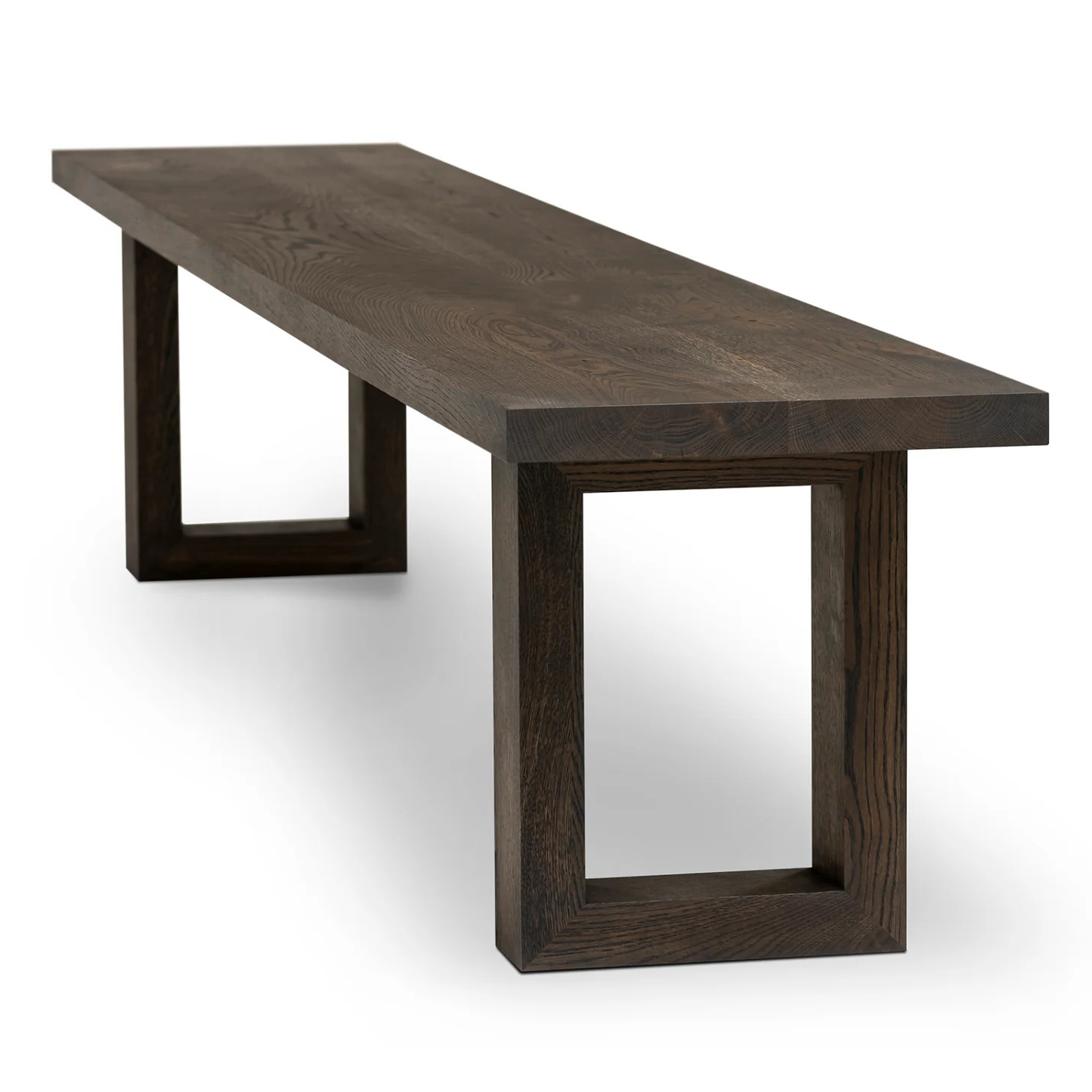 Handcrafted solid wood dining bench in dark oak with wooden legs.