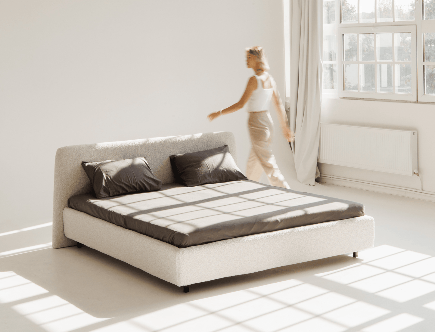 Luxury upholstered bed with tufted headboard – perfect for contemporary homes.