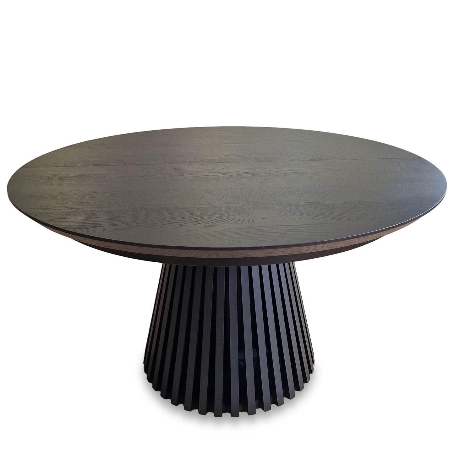 Round extendable solid wood dining table with wood pipe legs in black oak.
