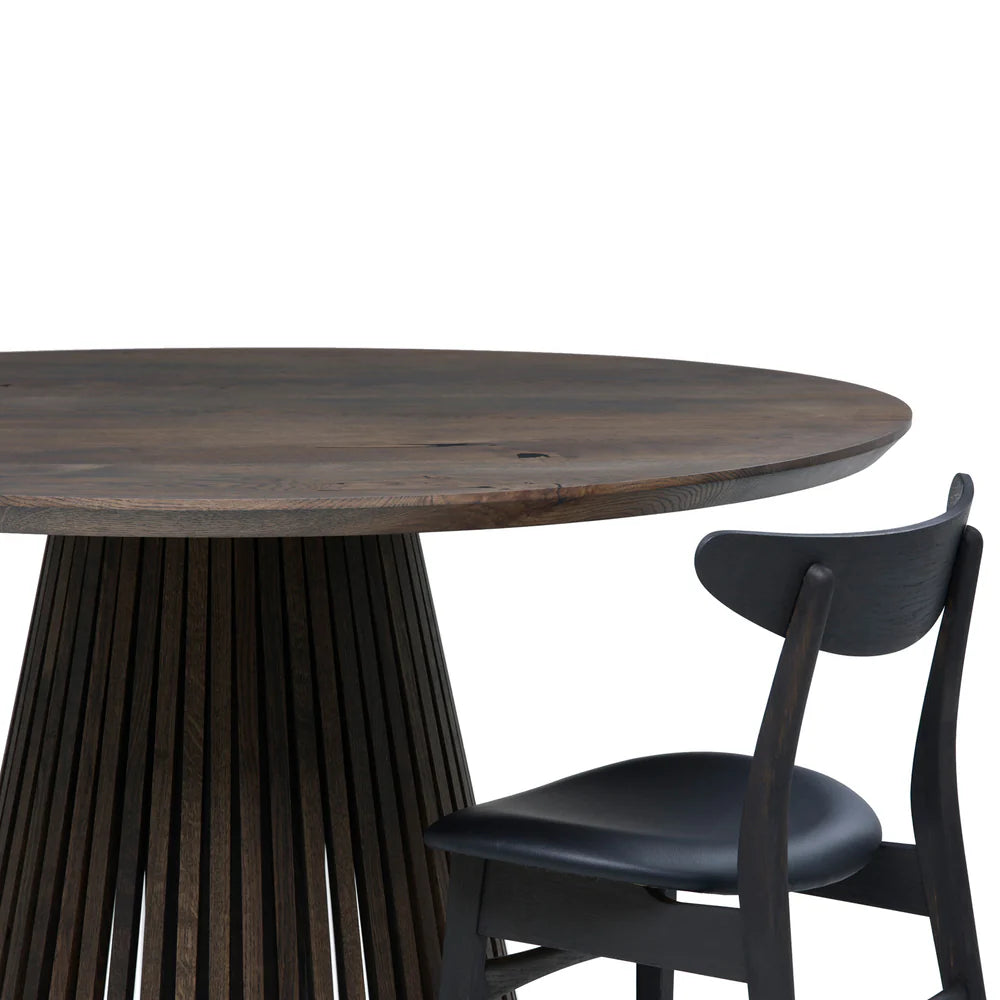 Round extendable solid wood dining table with wood pipe legs in dark oak.