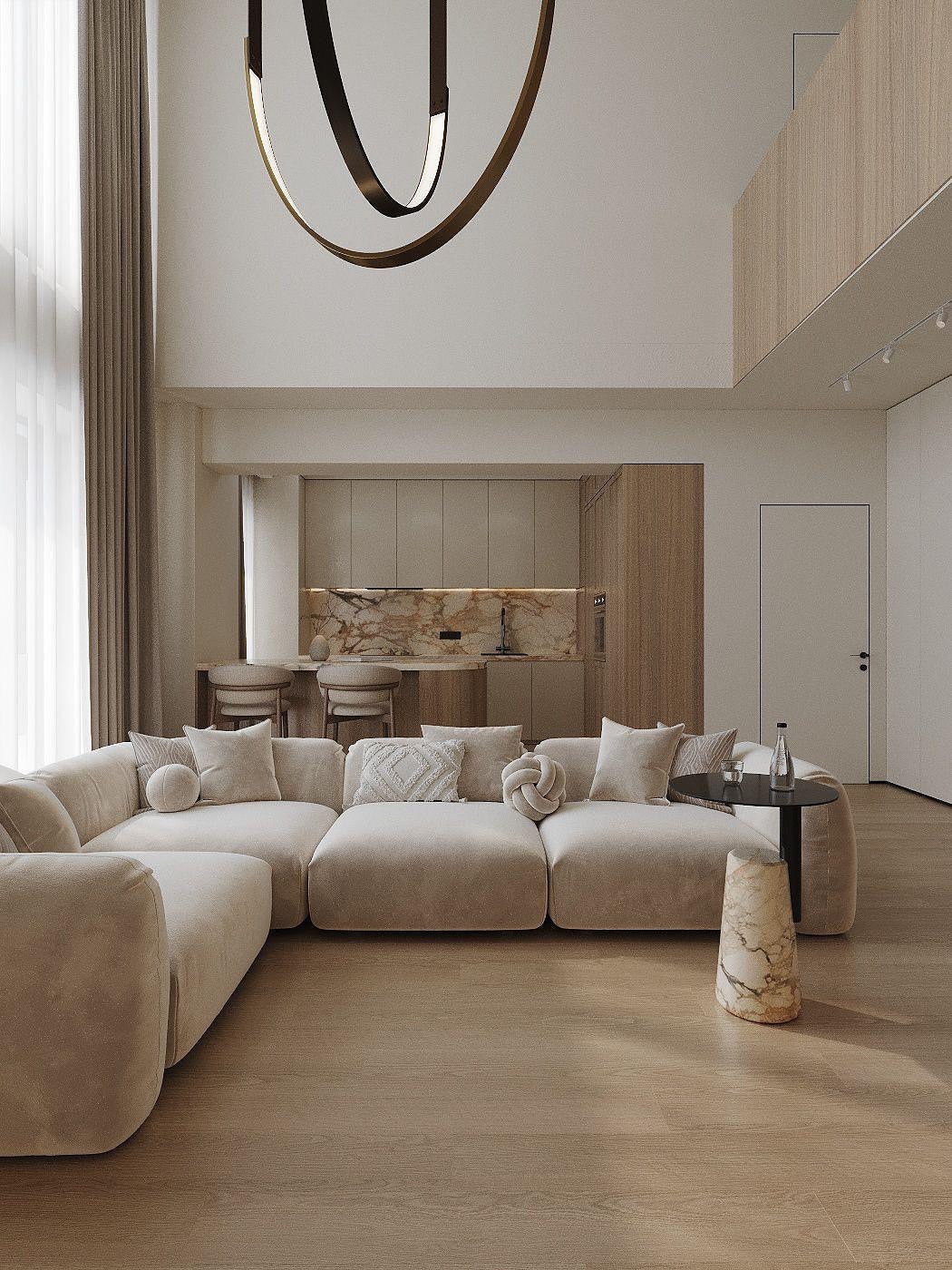 Modern luxury beige modular sofa in L shape with stylish pillows in an elegant living room with kitchen and bar table in the back. 