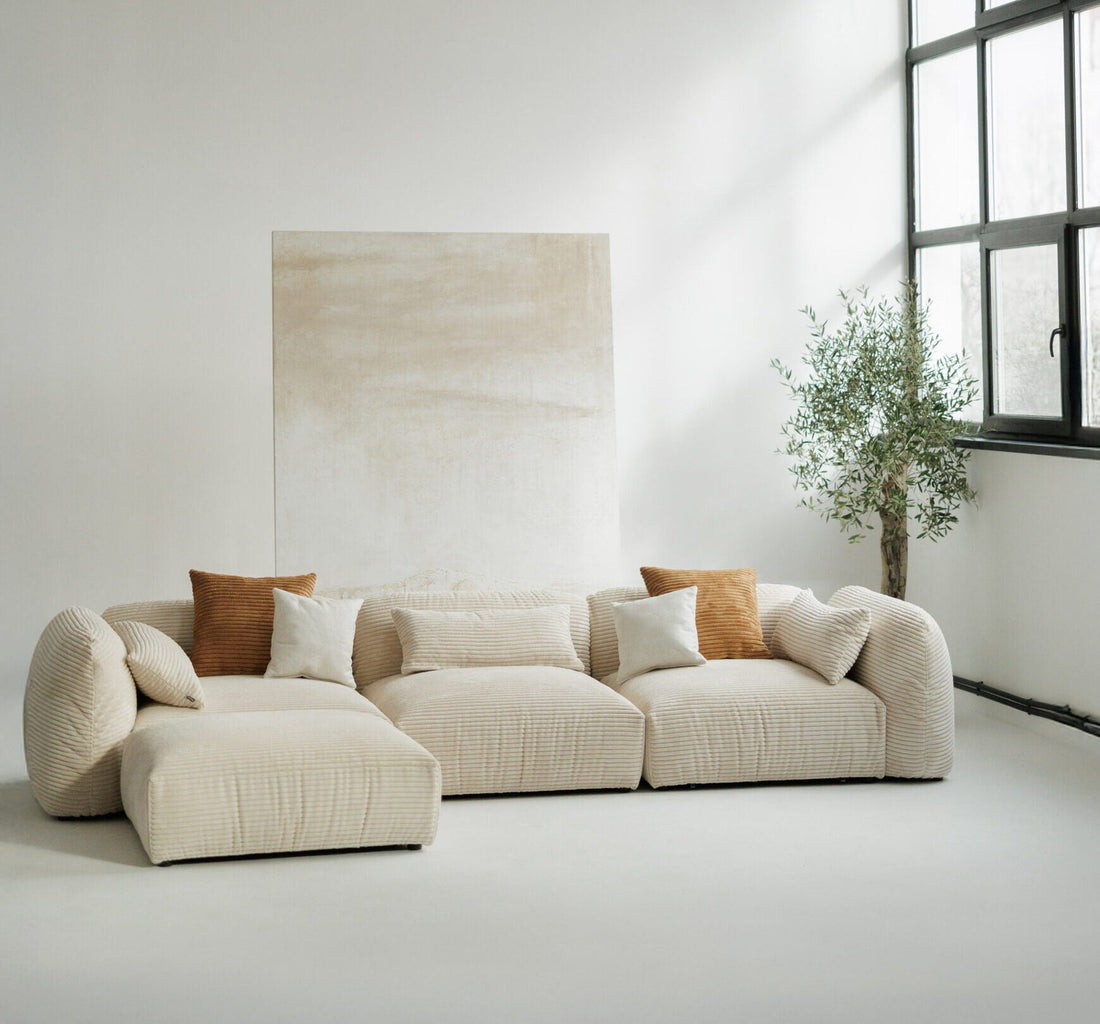Stor beige manchester-modulsofa med ottoman, laget i Europa
