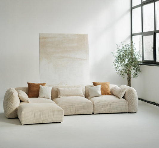 Stor beige manchester-modulsofa med ottoman, laget i Europa