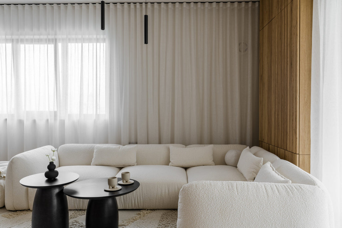 modern modular sofa in white bouclé fabric in a beautifully designed contemporary living room interior