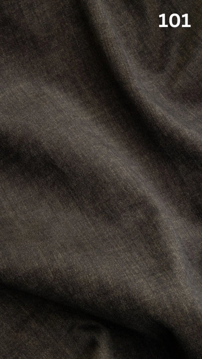 Close-up of black velvet fabric texture with a slight pattern and number '101' in the corner. 