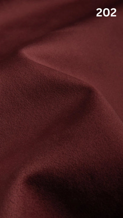 Premium velvet fabric for sofas in red with a number '202' in the corner. 