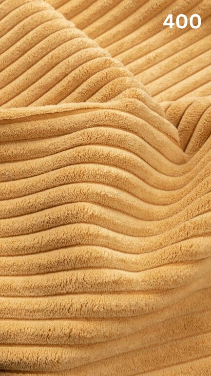 Close-up of yellow textured premium corduroy fabric for sofas with a number '400' in the corner. 