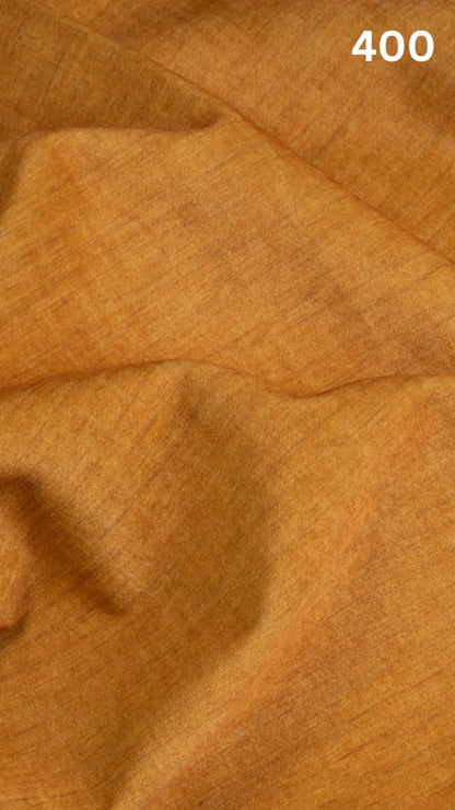 Close-up of yellow colored velvet fabric for sofas with a slight pattern and number '400' in the corner. 