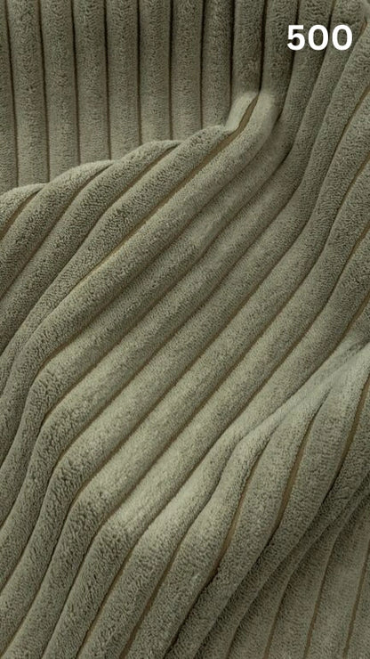 Close-up of green textured premium corduroy fabric for sofas with a number '500' in the corner. 