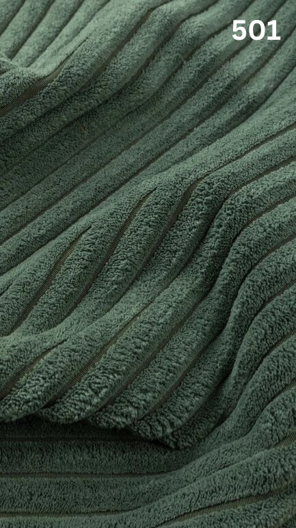 Close-up of mint colored textured premium corduroy fabric for sofas with a number '501' in the corner. 