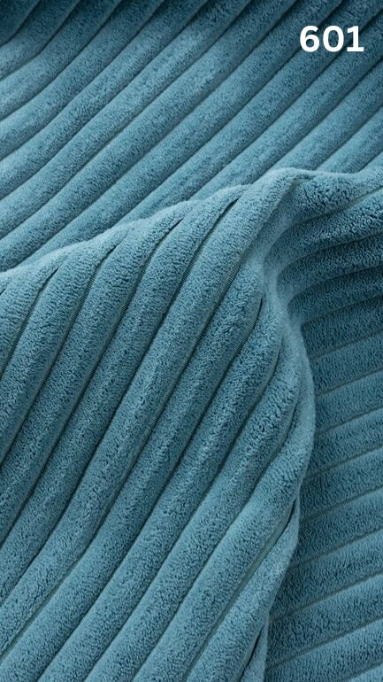 Close-up of blue textured premium corduroy fabric for sofas with a number '601' in the corner. 
