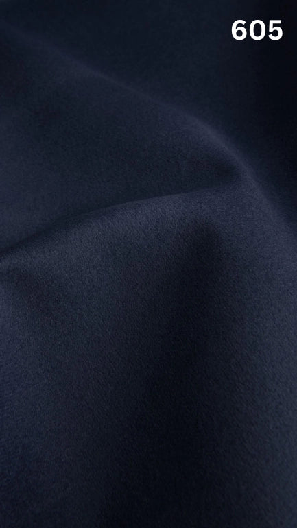 Premium velvet fabric for sofas in blue with a number '605' in the corner. 
