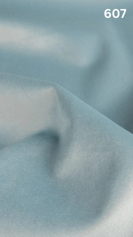 Premium velvet fabric for sofas in light blue with a number '607' in the corner. 