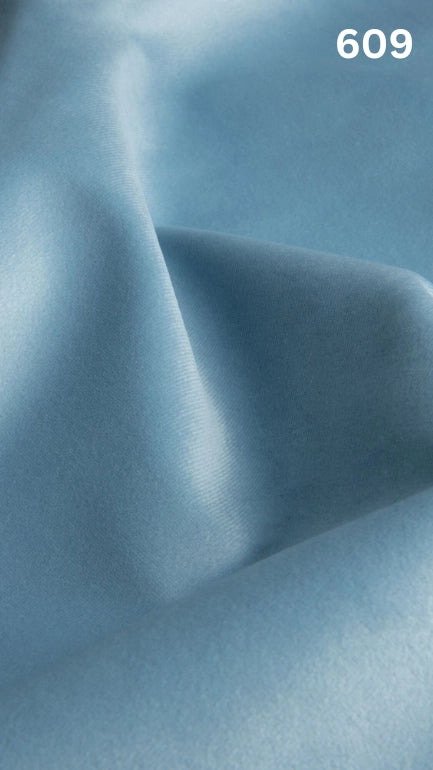 Premium velvet fabric for sofas in light blue with a number '609' in the corner. 