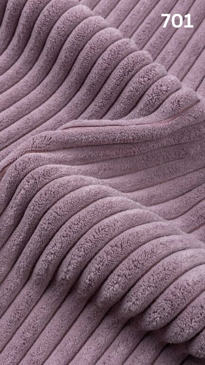 Close-up of violet textured premium corduroy fabric for sofas with a number '701' in the corner. 