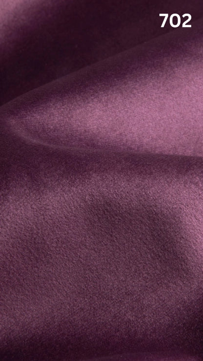 Premium velvet fabric for sofas in purple with a number '702' in the corner. 