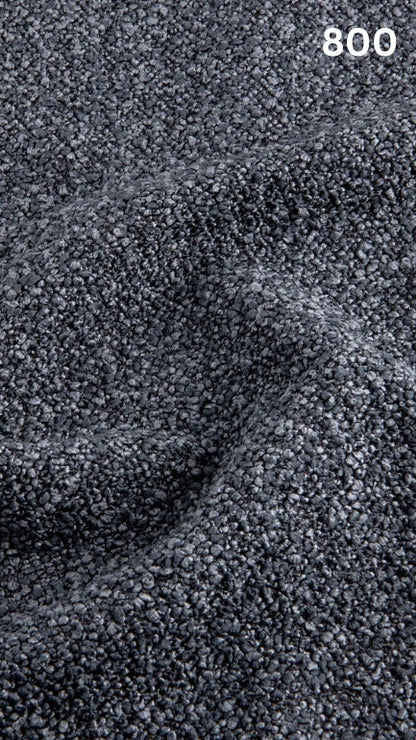 Close-up of textured blue bouclé fabric for sofas with a pattern and number '800' in the corner.