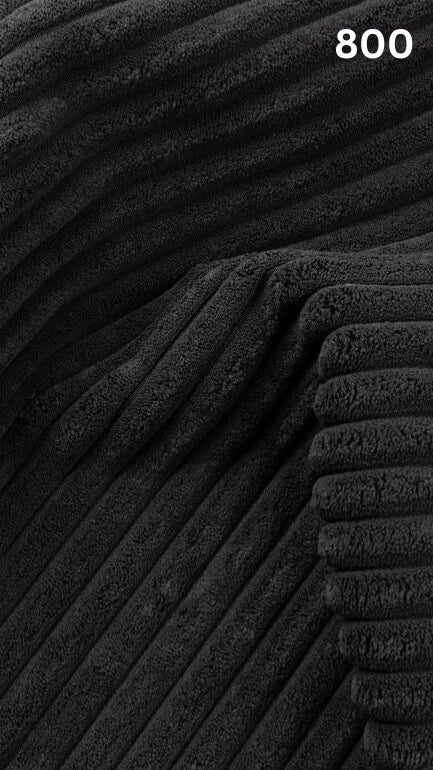 Close-up of black textured premium corduroy fabric for sofas with a number '800' in the corner. 