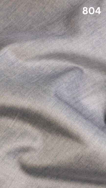 Close-up of gray colored velvet fabric for sofas with a slight pattern and number '804' in the corner. 