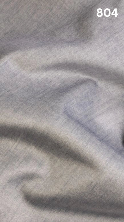 Close-up of gray colored velvet fabric for sofas with a slight pattern and number '804' in the corner. 