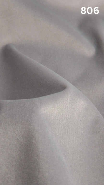 Premium velvet fabric for sofas in white with a number '806' in the corner. 