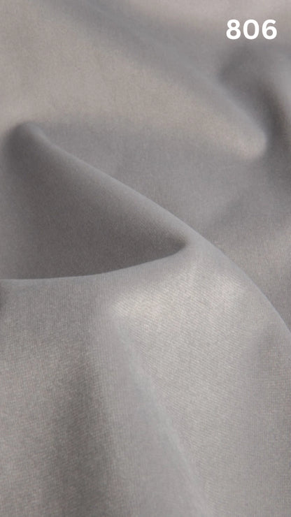 Premium velvet fabric for sofas in white with a number '806' in the corner. 