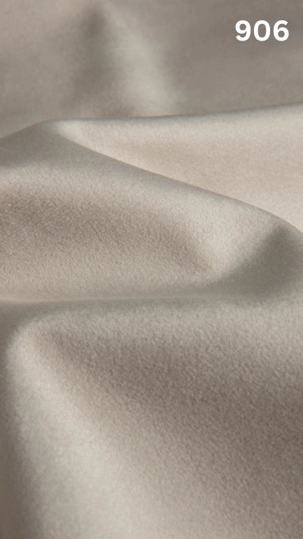 Premium velvet fabric for sofas in white with a number '906' in the corner. 