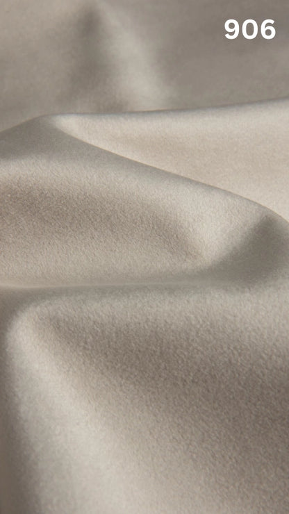 Premium velvet fabric for sofas in white with a number '906' in the corner. 