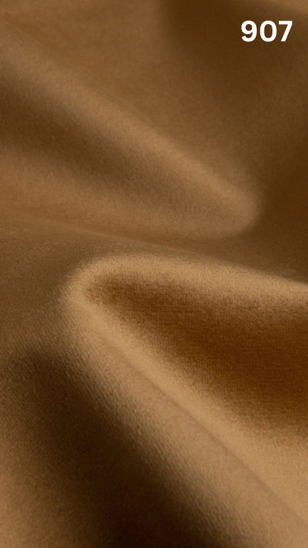 Premium velvet fabric for sofas in yellow with a number '907' in the corner. 